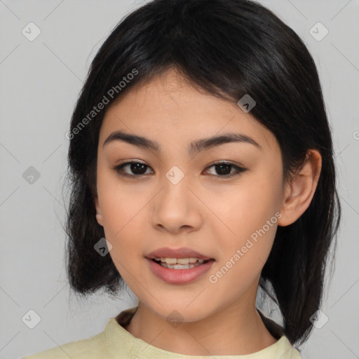 Joyful asian young-adult female with medium  black hair and brown eyes