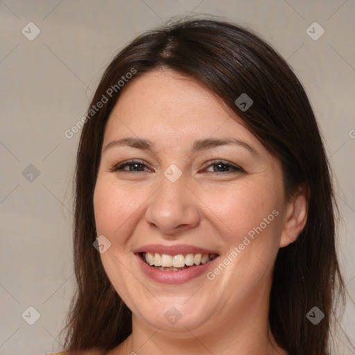 Joyful white adult female with medium  brown hair and brown eyes