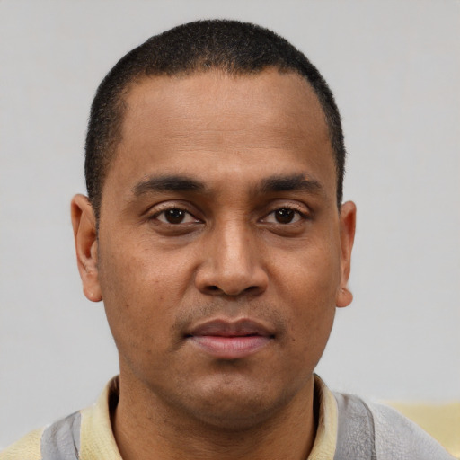 Neutral latino young-adult male with short  brown hair and brown eyes