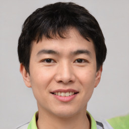 Joyful asian young-adult male with short  brown hair and brown eyes