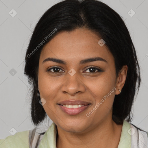 Joyful black young-adult female with medium  brown hair and brown eyes