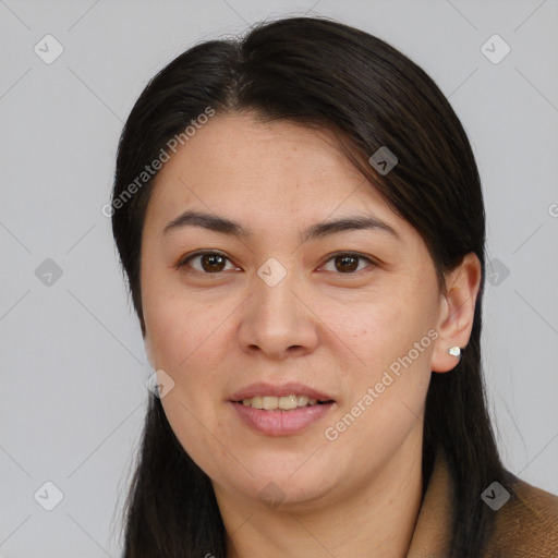 Joyful asian young-adult female with long  brown hair and brown eyes