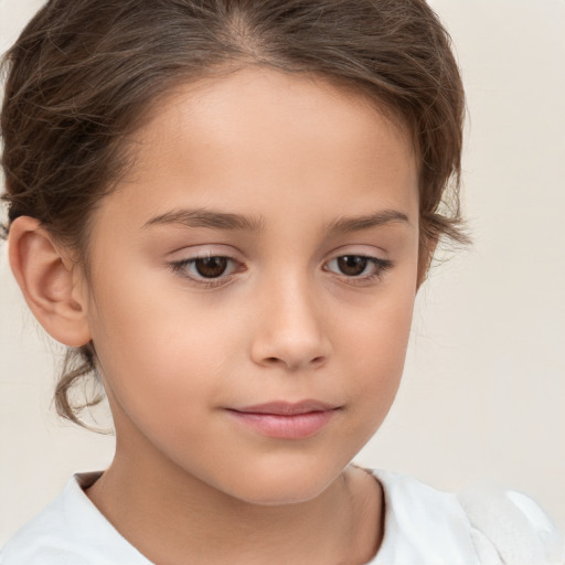 Joyful white child female with short  brown hair and brown eyes