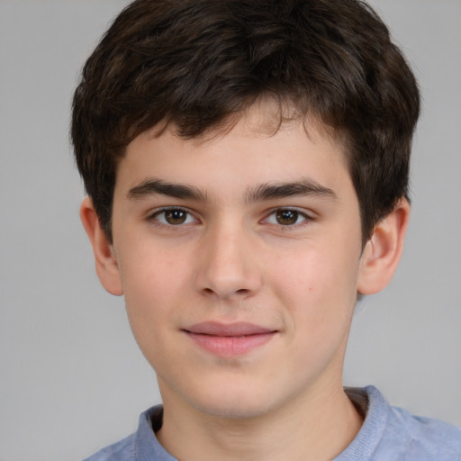 Joyful white child male with short  brown hair and brown eyes