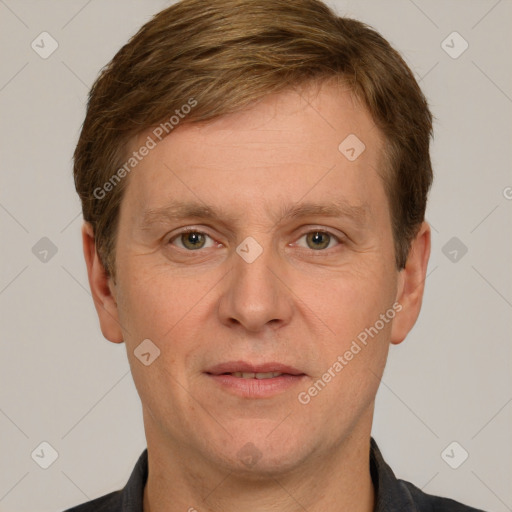 Joyful white adult male with short  brown hair and grey eyes