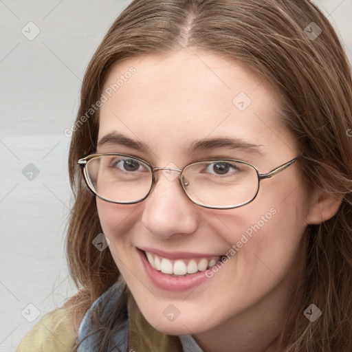 Joyful white young-adult female with long  brown hair and blue eyes