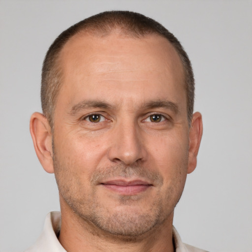 Joyful white adult male with short  brown hair and brown eyes