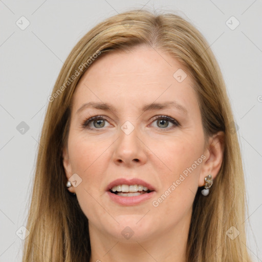 Joyful white adult female with long  brown hair and grey eyes