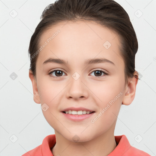 Joyful white child female with short  brown hair and brown eyes