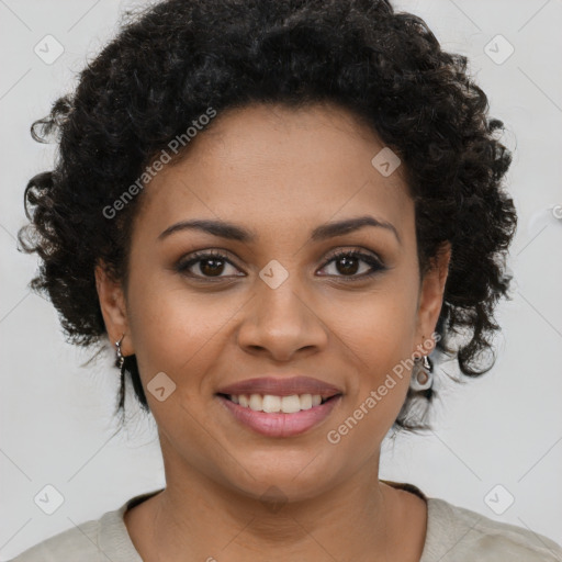 Joyful black young-adult female with short  brown hair and brown eyes