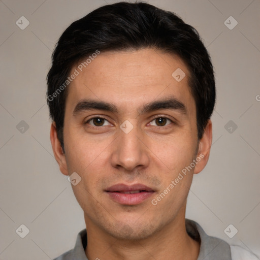 Joyful white young-adult male with short  black hair and brown eyes