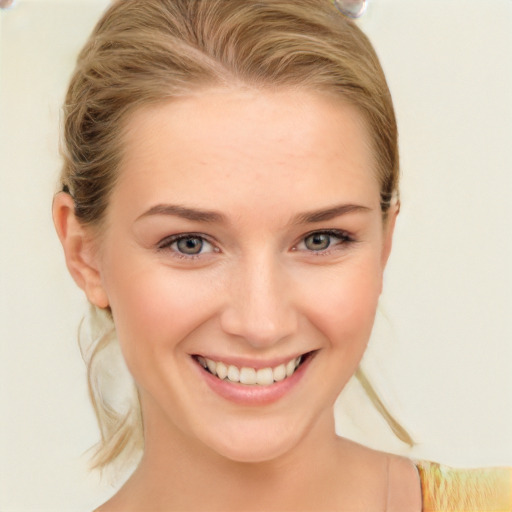 Joyful white young-adult female with long  brown hair and blue eyes