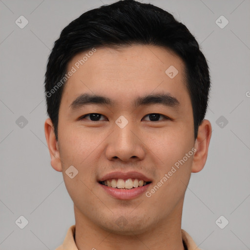 Joyful asian young-adult male with short  black hair and brown eyes