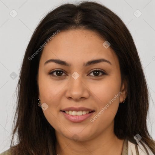 Joyful latino young-adult female with long  brown hair and brown eyes