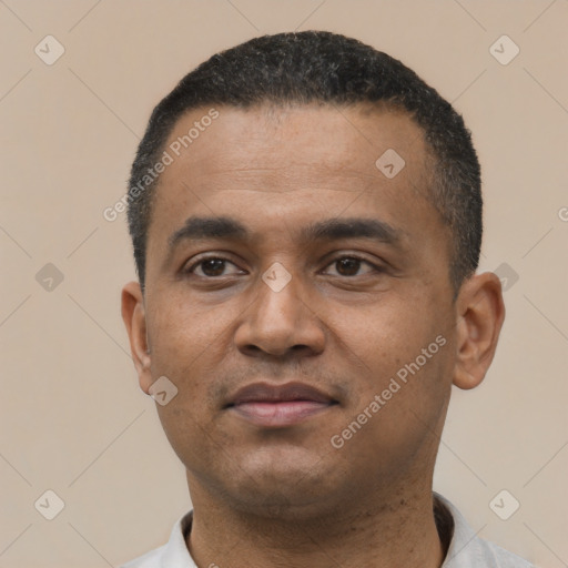 Neutral latino young-adult male with short  black hair and brown eyes