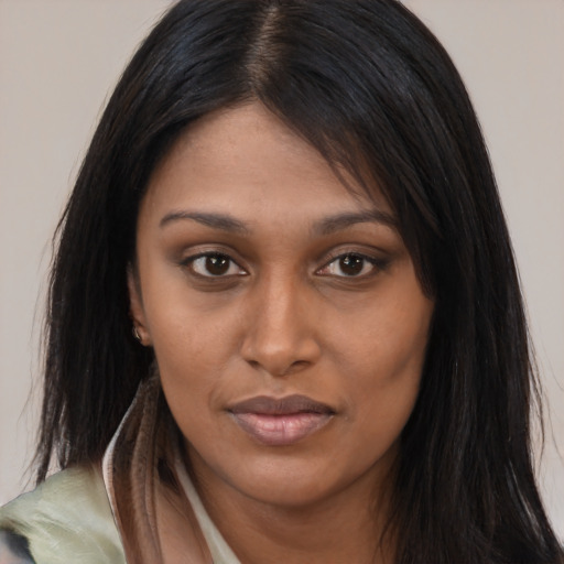 Joyful asian young-adult female with long  brown hair and brown eyes