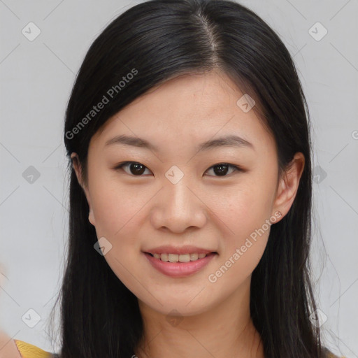 Joyful asian young-adult female with long  brown hair and brown eyes