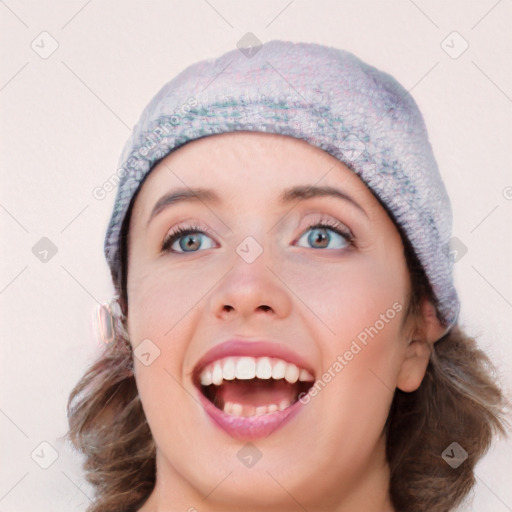 Joyful white young-adult female with medium  brown hair and blue eyes