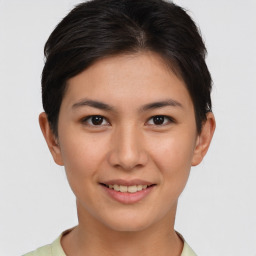 Joyful asian young-adult female with short  brown hair and brown eyes