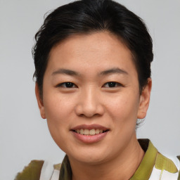 Joyful asian young-adult female with short  brown hair and brown eyes