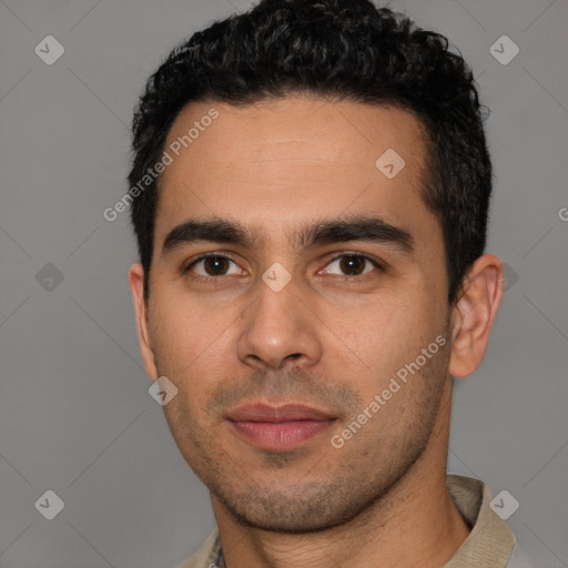 Joyful white young-adult male with short  black hair and brown eyes