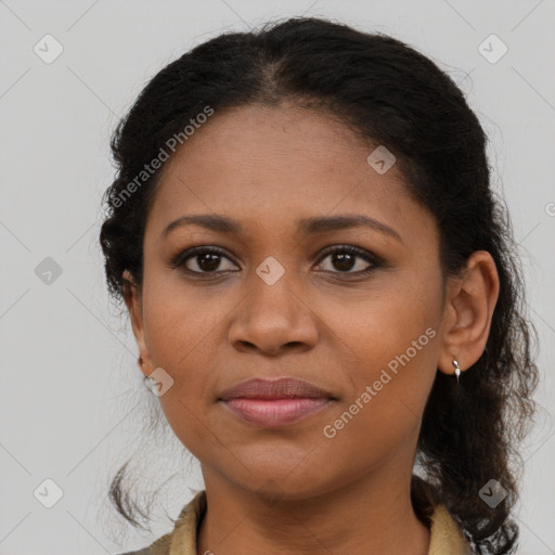 Joyful black young-adult female with medium  brown hair and brown eyes