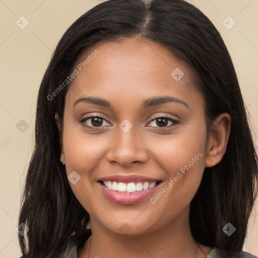 Joyful latino young-adult female with long  brown hair and brown eyes