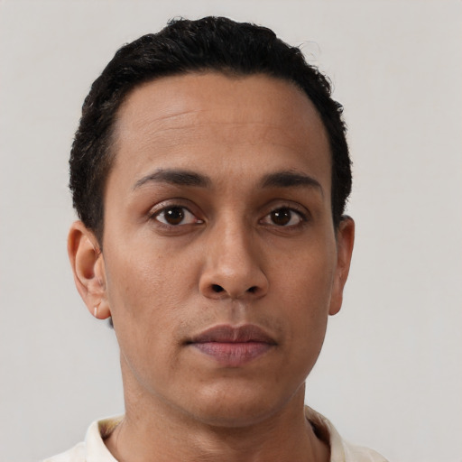 Neutral latino young-adult male with short  black hair and brown eyes