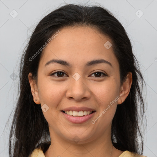 Joyful latino young-adult female with medium  brown hair and brown eyes