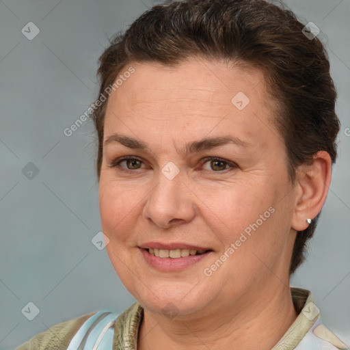 Joyful white adult female with medium  brown hair and brown eyes