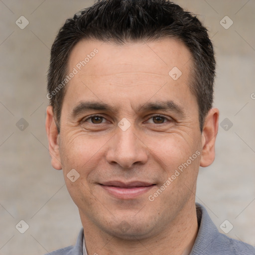 Joyful white adult male with short  brown hair and brown eyes