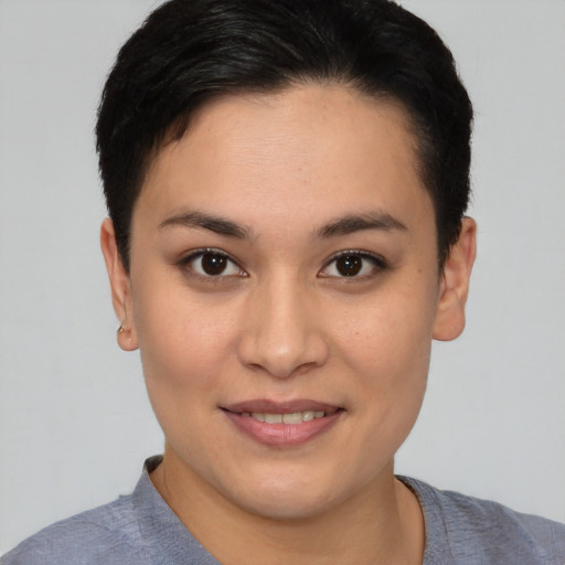 Joyful white young-adult female with short  black hair and brown eyes
