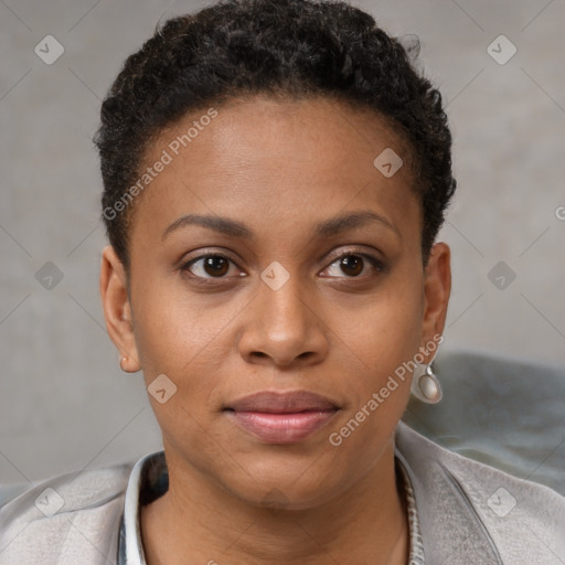 Joyful black young-adult female with short  brown hair and brown eyes