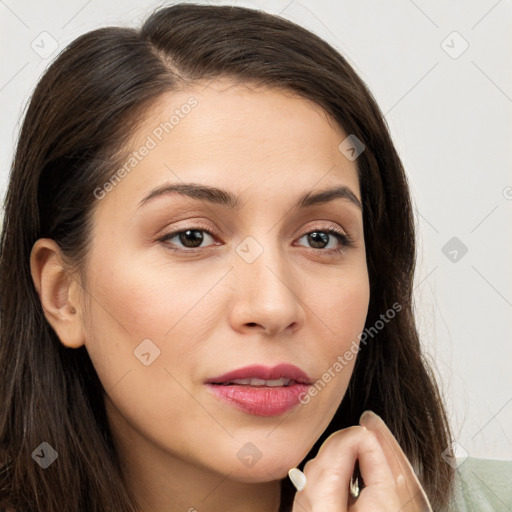 Joyful white young-adult female with long  brown hair and brown eyes