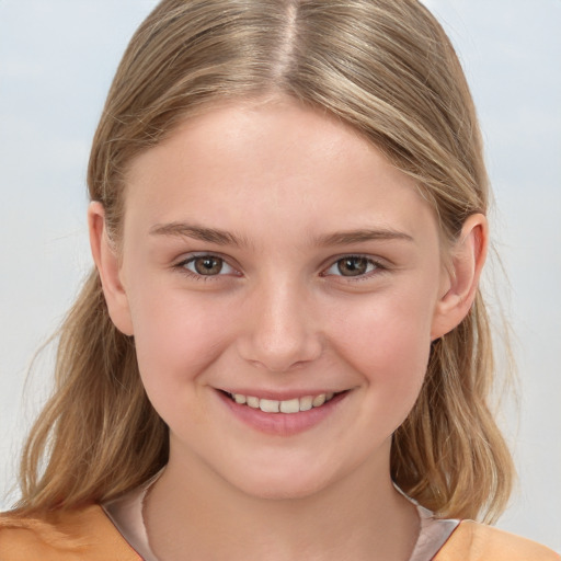 Joyful white child female with medium  brown hair and brown eyes