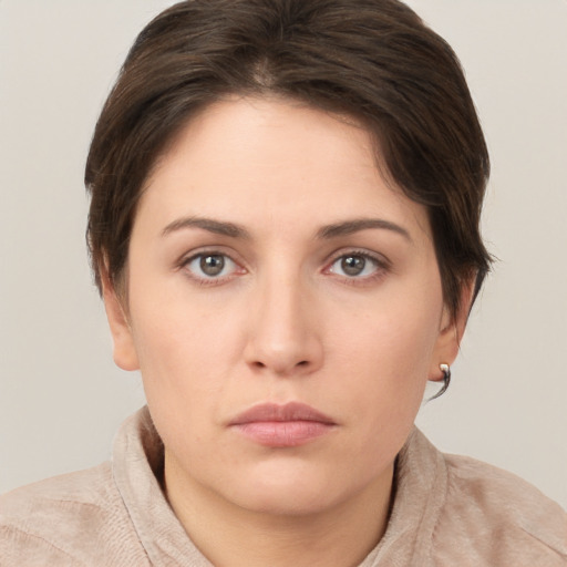 Neutral white young-adult female with short  brown hair and brown eyes