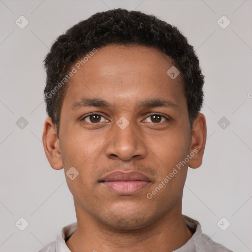 Neutral black young-adult male with short  brown hair and brown eyes