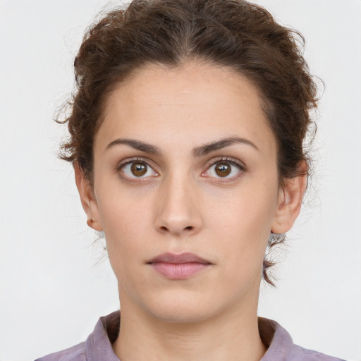 Neutral white young-adult female with short  brown hair and brown eyes