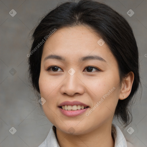 Joyful asian young-adult female with medium  brown hair and brown eyes