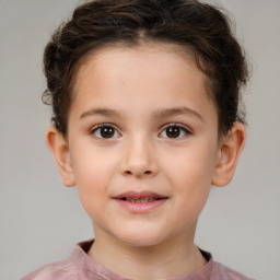 Joyful white child female with short  brown hair and brown eyes