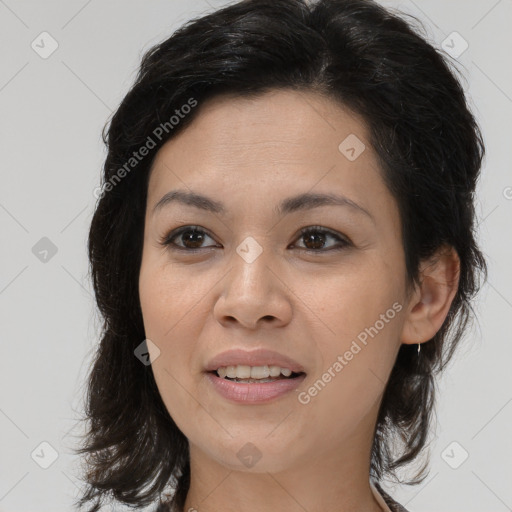 Joyful latino young-adult female with medium  brown hair and brown eyes