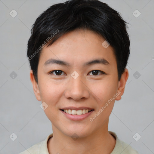 Joyful asian young-adult female with short  black hair and brown eyes