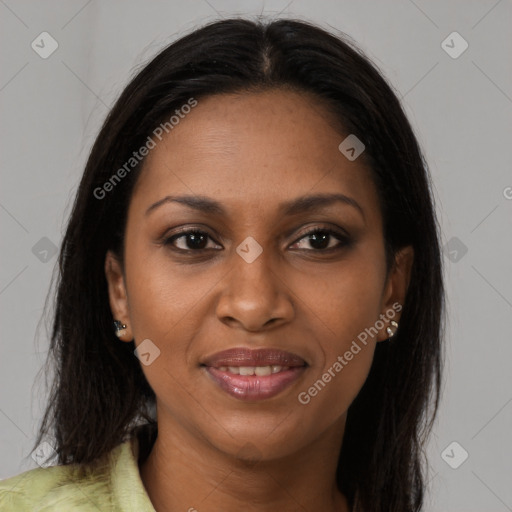 Joyful black young-adult female with long  brown hair and brown eyes