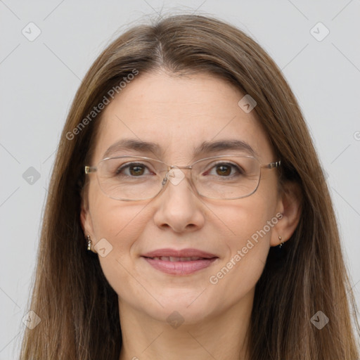 Joyful white adult female with long  brown hair and grey eyes