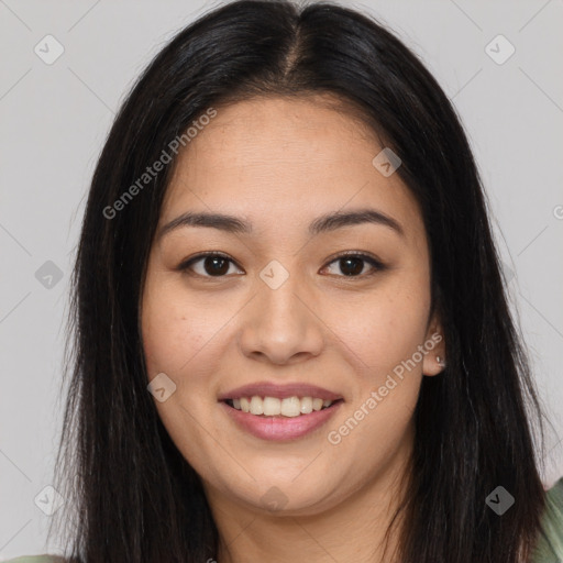 Joyful asian young-adult female with long  brown hair and brown eyes