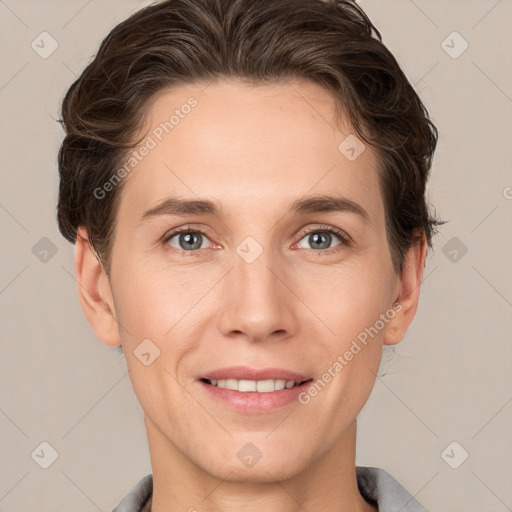 Joyful white young-adult female with short  brown hair and grey eyes