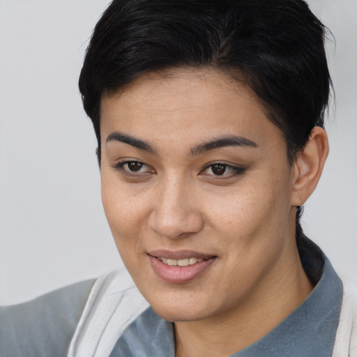Joyful asian young-adult female with short  brown hair and brown eyes