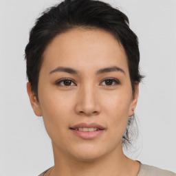 Joyful asian young-adult female with short  brown hair and brown eyes