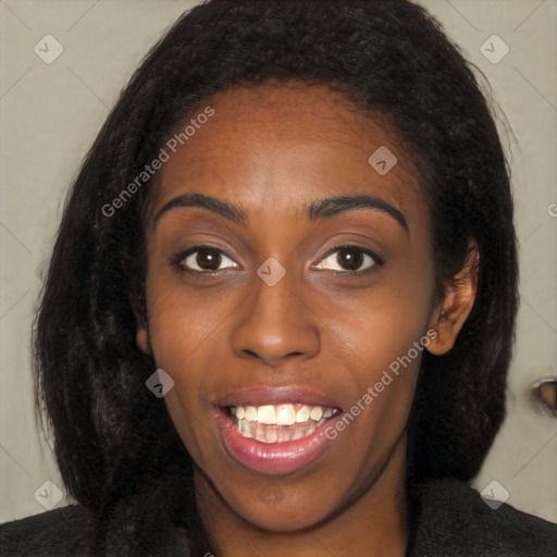 Joyful black young-adult female with long  black hair and brown eyes