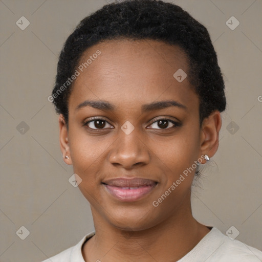 Joyful black young-adult female with short  black hair and brown eyes